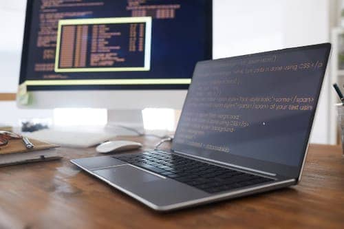 Webste Development monitor and laptop