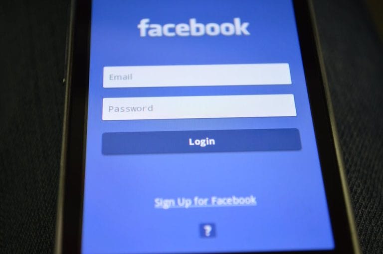 The facebook login screen is displayed on a cell phone.